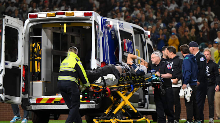 May 12, 2025; Seattle, Washington, USA; New York Yankees third baseman Oswaldo Cabrera (95) is loaded into an ambulance after a leg injury while scoring a run against the Seattle Mariners during the eighth inning at T-Mobile Park.