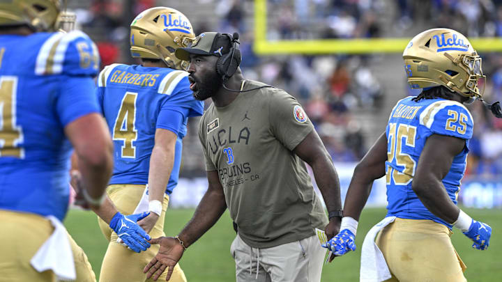 Nov 30, 2024; Pasadena, California, USA; UCLA Bruins head coach DeShaun Foster greets his players after a Bruins touchdown against the Fresno State Bulldogs in the third quarter at Rose Bowl. Mandatory Credit: Robert Hanashiro-Imagn Images