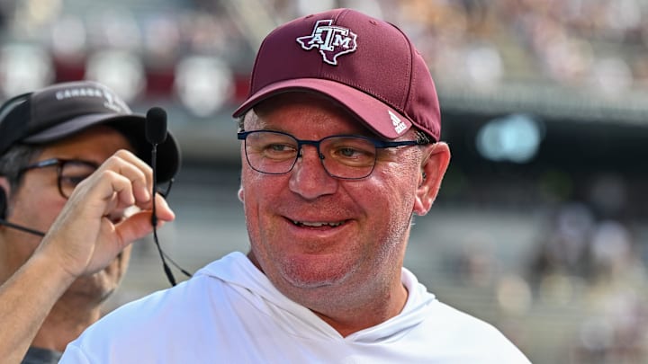 Oct 5, 2024; College Station, Texas, USA; Texas A&M Aggies head coach Mike Elko gets ready for a pre-game interview with the SEC Nation prior to the game against the Missouri Tigers at Kyle Field. Mandatory Credit: Maria Lysaker-Imagn Images. 