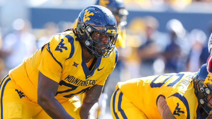 Aug 30, 2025; Morgantown, West Virginia, USA; West Virginia Mountaineers offensive lineman Ty'Kieast Crawford (74) pauses before a snap during the third quarter against the Robert Morris Colonials at Milan Puskar Stadium. Mandatory Credit: Ben Queen-Imagn Images
