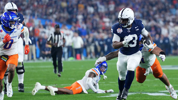 Penn State Nittany Lions running back Kaytron Allen (13) rushes the ball against the Boise State Broncos during the first half in the Fiesta Bowl at State Farm Stadium.
