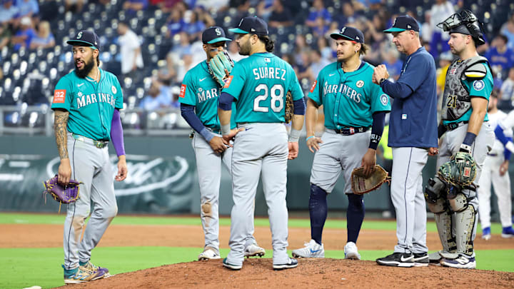 Sep 16, 2025; Kansas City, Missouri, USA; Members of the Seattle Mariners wait at home plate for a relief pitcher to come in during the eighth inning against the Kansas City Royals at Kauffman Stadium. Mandatory Credit: Scott Sewell-Imagn Images Sep 16, 2025; Kansas City, Missouri, USA; Members of the Seattle Mariners wait at home plate for a relief pitcher to come in during the eighth inning against the Kansas City Royals at Kauffman Stadium. Mandatory Credit: Scott Sewell-Imagn Images