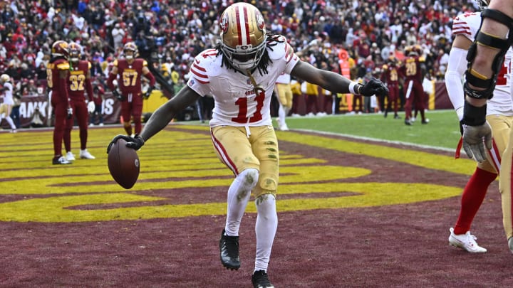 Dec 31, 2023; Landover, Maryland, USA; San Francisco 49ers wide receiver Brandon Aiyuk (11) celebrates after scoring a touchdown against the Washington Commanders during the second half at FedExField. Mandatory Credit: Brad Mills-USA TODAY Sports Dec 31, 2023; Landover, Maryland, USA; San Francisco 49ers wide receiver Brandon Aiyuk (11) celebrates after scoring a touchdown against the Washington Commanders during the second half at FedExField. Mandatory Credit: Brad Mills-USA TODAY Sports