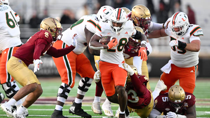 Nov 24, 2023; Chestnut Hill, Massachusetts, USA; Miami Hurricanes running back Ajay Allen (28) rushes against the Boston College Eagles during the second half at Alumni Stadium. Mandatory Credit: Brian Fluharty-USA TODAY Sports