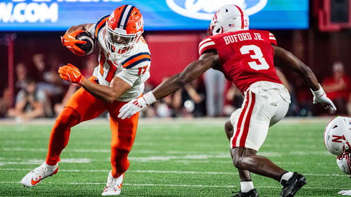 Sep 20, 2024; Lincoln, Nebraska, USA; Illinois Fighting Illini wide receiver Collin Dixon (17) runs after a catch against Nebraska Cornhuskers defensive back Marques Buford Jr. (3) during the second quarter at Memorial Stadium. Mandatory Credit: Dylan Widger-Imagn Images Sep 20, 2024; Lincoln, Nebraska, USA; Illinois Fighting Illini wide receiver Collin Dixon (17) runs after a catch against Nebraska Cornhuskers defensive back Marques Buford Jr. (3) during the second quarter at Memorial Stadium. Mandatory Credit: Dylan Widger-Imagn Images