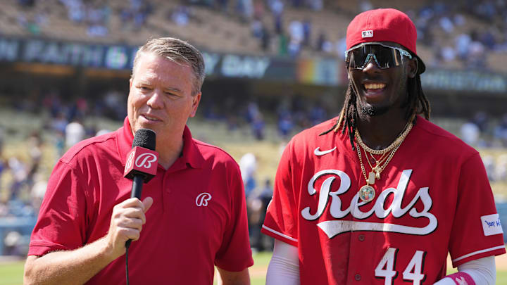 Bally Sports reporter Jim Day (left) interviews Cincinnati Reds shortstop Elly De La Cruz