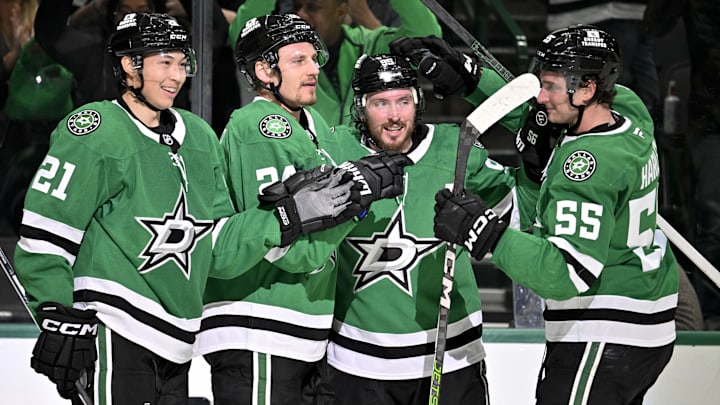 Mar 6, 2025; Dallas, Texas, USA; Dallas Stars left wing Jason Robertson (21) and center Matt Duchene (95) and center Roope Hintz (24) and defenseman Thomas Harley (55) celebrates after Robertson scores the game winning goal the Calgary Flames during the overtime period at the American Airlines Center. Mandatory Credit: Jerome Miron-Imagn Images