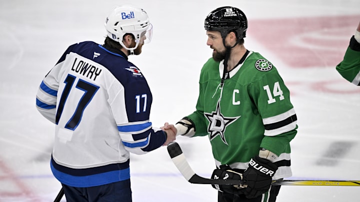 May 17, 2025; Dallas, Texas, USA; Winnipeg Jets center Adam Lowry (17) shakes hands with Dallas Stars left wing Jamie Benn (14) after the Stars defeat the Jets in the overtime period in game six of the second round of the 2025 Stanley Cup Playoffs at American Airlines Center. Mandatory Credit: Jerome Miron-Imagn Images