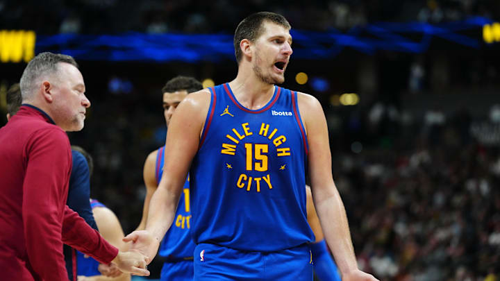 Nov 4, 2023; Denver, Colorado, USA; Denver Nuggets center Nikola Jokic (15) reacts next to head coach Michael Malone in the second half against the Chicago Bulls at Ball Arena. Mandatory Credit: Ron Chenoy-Imagn Images Nov 4, 2023; Denver, Colorado, USA; Denver Nuggets center Nikola Jokic (15) reacts next to head coach Michael Malone in the second half against the Chicago Bulls at Ball Arena. Mandatory Credit: Ron Chenoy-Imagn Images