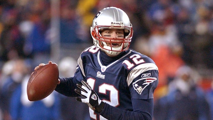 Patriots' quarterback Tom Brady rolls out vs. Tennessee January 10, 2004.