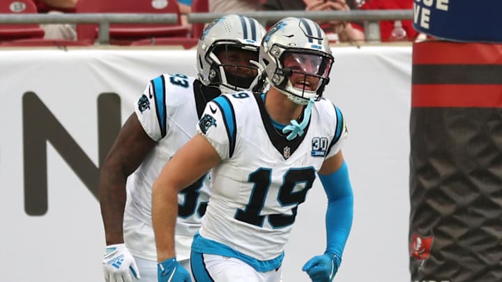 Dec 29, 2024; Tampa, Florida, USA; Carolina Panthers wide receiver Adam Thielen (19) is congratulated after he scored a touchdown against the Tampa Bay Buccaneersduring the second quarter at Raymond James Stadium. Mandatory Credit: Kim Klement Neitzel-Imagn Images