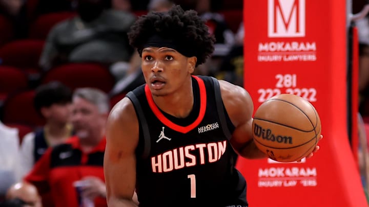 Mar 13, 2026; Houston, Texas, USA;  Houston Rockets guard Amen Thompson (1) handles the ball against the New Orleans Pelicans during the first quarter at Toyota Center. Mandatory Credit: Erik Williams-Imagn Images