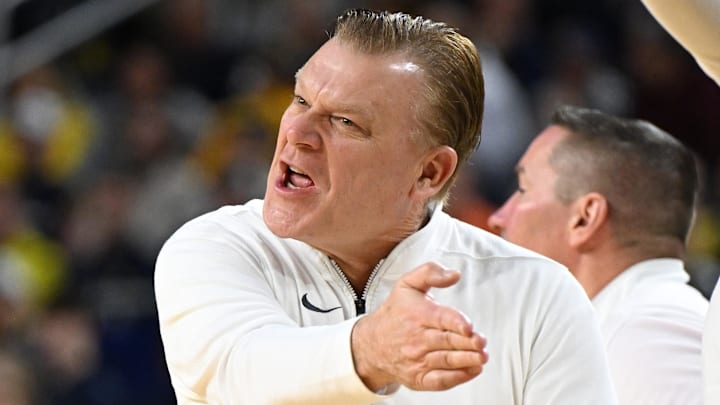 Mar 2, 2025; Ann Arbor, Michigan, USA;  Illinois Fighting Illini head coach Brad Underwood yells to his team from the bench during their game against the Michigan Wolverines in the first half at Crisler Center. Mandatory Credit: Lon Horwedel-Imagn Images