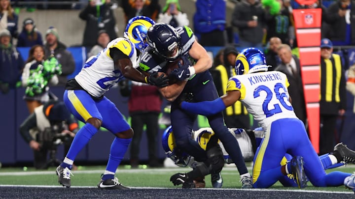 Jan 25, 2026; Seattle, WA, USA; Seattle Seahawks wide receiver Cooper Kupp (10) scores a touchdown against Los Angeles Rams safety Kamren Kinchens (26) during the second half in the 2026 NFC Championship Game at Lumen Field. Mandatory Credit: Kevin Ng-Imagn Images
