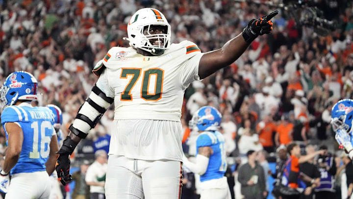 Miami (FL) Hurricanes offensive lineman Markel Bell (70) celebrates after going up 31-27 against the Mississippi Rebels late in the fourth quarter during the Vrbo Fiesta Bowl and CFP semifinal game at State Farm Stadium on Jan. 8, 2026, in Glendale.