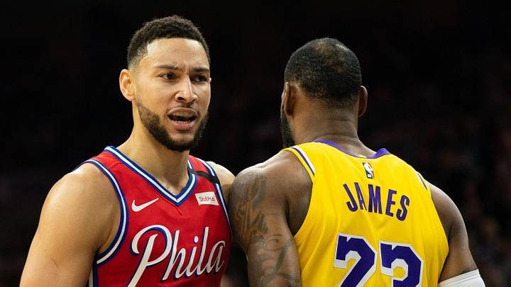Philadelphia 76ers guard Ben Simmons (25) walks past Los Angeles Lakers forward LeBron James (23) during a game  at Wells Fargo Center. 