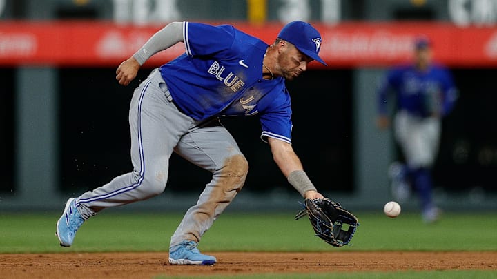 Sep 1, 2023; Denver, Colorado, USA; Toronto Blue Jays second baseman Whit Merrifield (15) fields the