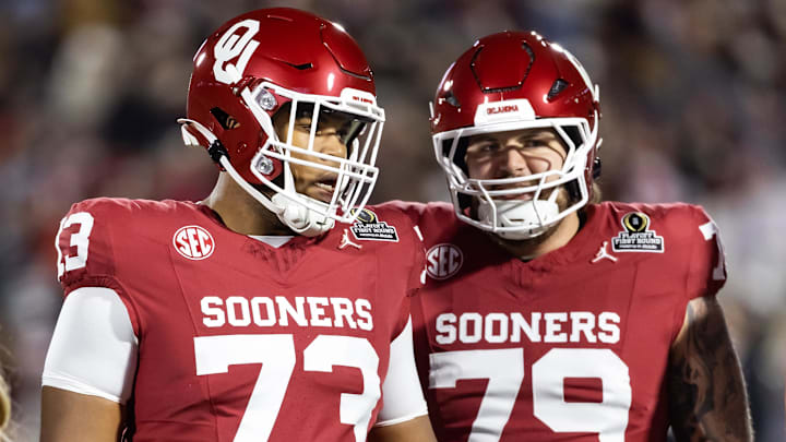 Oklahoma Sooners offensive linemen Isaiah Dent (73) and Jake Taylor (79) suit up against the Alabama Crimson Tide during the CFP.