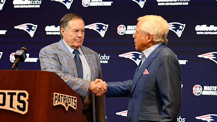 Jan 11, 2024; Foxborough, MA, USA; New England Patriots former head coach Bill Belichick (left) shakes hands with Patriots owner Robert Kraft (right) during a press conference at Gillette Stadium to announce Belichick's exit from the team. Mandatory Credit: Eric Canha-Imagn Images