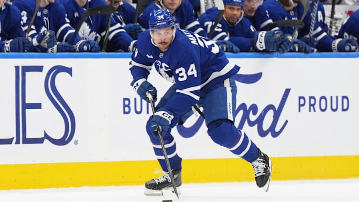 Dec 6, 2024; Toronto, Ontario, CAN; Toronto Maple Leafs center Auston Matthews (34) skates with the puck against the Washington Capitals during  the third period at Scotiabank Arena. Mandatory Credit: Nick Turchiaro-Imagn Images