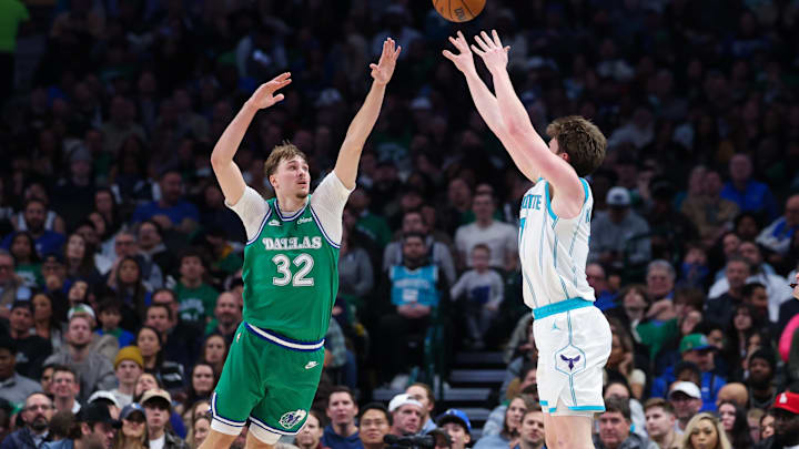 Jan 29, 2026; Dallas, Texas, USA;  Charlotte Hornets guard Kon Knueppel (7) shoots over Dallas Mavericks forward Cooper Flagg (32) during the second half at American Airlines Center. Mandatory Credit: Kevin Jairaj-Imagn Images
