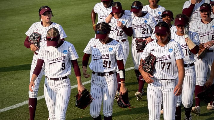 May 26, 2024; Austin, Texas; USA: The Texas A&M Aggies' softball team walks back to their dugout prior to facing the Texas Longhorns in Game 3 of the NCAA Tournament Super Regionals.