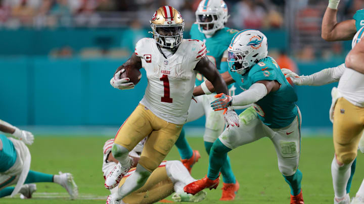 Dec 22, 2024; Miami Gardens, Florida, USA; San Francisco 49ers wide receiver Deebo Samuel Sr. (1) runs with the football past Miami Dolphins linebacker Anthony Walker Jr. (6) during the fourth quarter at Hard Rock Stadium. Mandatory Credit: Sam Navarro-Imagn Images Dec 22, 2024; Miami Gardens, Florida, USA; San Francisco 49ers wide receiver Deebo Samuel Sr. (1) runs with the football past Miami Dolphins linebacker Anthony Walker Jr. (6) during the fourth quarter at Hard Rock Stadium. Mandatory Credit: Sam Navarro-Imagn Images