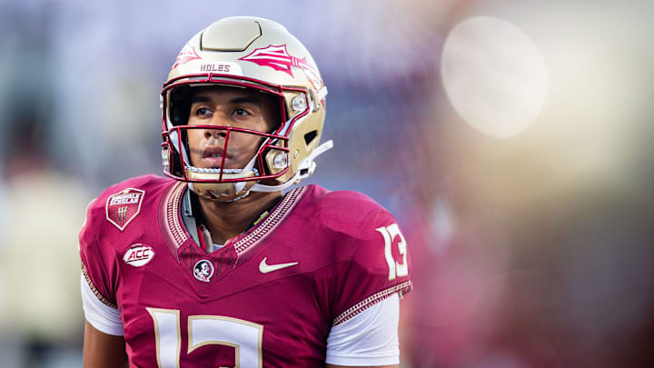 Florida State Seminoles quarterback Jordan Travis (13) warms up before kickoff at Camping World Stadium on Sunday, Sept. 3, 2023.