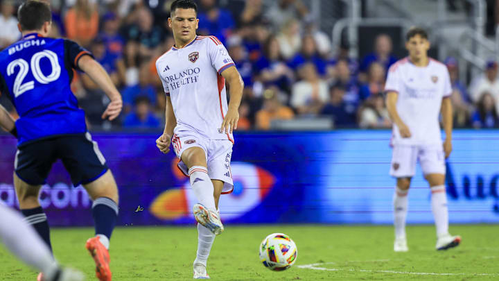 Oct 5, 2024; Cincinnati, Ohio, USA; Orlando City SC midfielder Cesar Araujo (5) kicks the ball against FC Cincinnati midfielder Pavel Bucha (20) in the second half at TQL Stadium. Mandatory Credit: Katie Stratman-Imagn Images