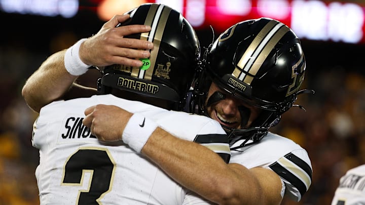 Purdue Boilermakers quarterback Malachi Singleton (3) and quarterback Ryan Browne (15) celebrate after a touchdown 