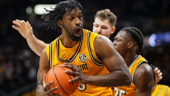 Dec 8, 2024; Columbia, Missouri, USA; Missouri Tigers center Josh Gray (33) grabs a rebound during the first half against the Kansas Jayhawks at Mizzou Arena. Mandatory Credit: Jay Biggerstaff-Imagn Images