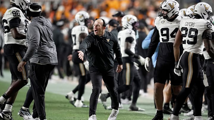Vanderbilt coach Clark Lea congratulates defensive players after they made a third down stop against Tennessee during the third quarter at Neyland Stadium in Knoxville, Tenn., Saturday, Nov. 29, 2025.
