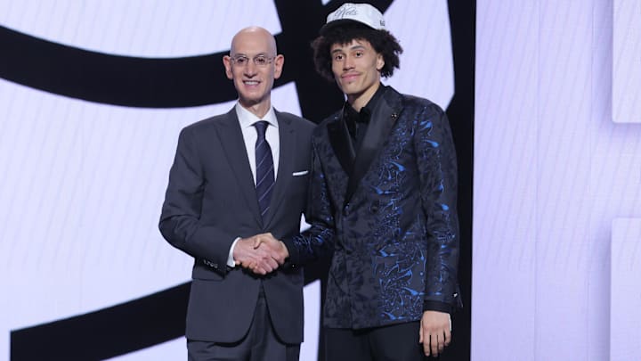 Jun 25, 2025; Brooklyn, NY, USA;  Nolan Traore stands with NBA commissioner Adam Silver after being selected as the 19th pick by the Brooklyn Nets in the first round of the 2025 NBA Draft at Barclays Center. Mandatory Credit: Brad Penner-Imagn Images