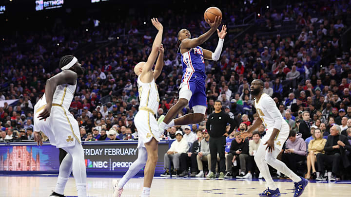 Nov 11, 2025; Philadelphia, Pennsylvania, USA; Philadelphia 76ers guard Tyrese Maxey (0) drives for a shot against Boston Celtics guard Jordan Walsh (27) and guard Jaylen Brown (7) during the fourth quarter at Xfinity Mobile Arena. Mandatory Credit: Bill Streicher-Imagn Images Nov 11, 2025; Philadelphia, Pennsylvania, USA; Philadelphia 76ers guard Tyrese Maxey (0) drives for a shot against Boston Celtics guard Jordan Walsh (27) and guard Jaylen Brown (7) during the fourth quarter at Xfinity Mobile Arena. Mandatory Credit: Bill Streicher-Imagn Images