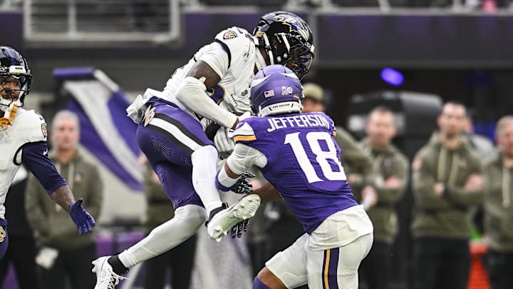 Nov 9, 2025; Minneapolis, Minnesota, USA; Baltimore Ravens cornerback Marlon Humphrey (44) makes an interception as Minnesota Vikings wide receiver Justin Jefferson (18) attempts to defend during the second quarter at U.S. Bank Stadium. Nov 9, 2025; Minneapolis, Minnesota, USA; Baltimore Ravens cornerback Marlon Humphrey (44) makes an interception as Minnesota Vikings wide receiver Justin Jefferson (18) attempts to defend during the second quarter at U.S. Bank Stadium.