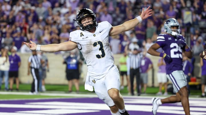 Army quarterback Cale Hellums celebrates a game-winning touchdown against Kansas State after his team lost to Tarleton State of the FCS just a few weeks prior.