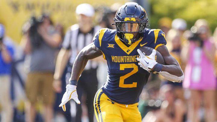 Sep 13, 2025; Morgantown, West Virginia, USA; West Virginia Mountaineers running back Tye Edwards (2) runs the ball during the second quarter against the Pittsburgh Panthers at Milan Puskar Stadium. Mandatory Credit: Ben Queen-Imagn Images Sep 13, 2025; Morgantown, West Virginia, USA; West Virginia Mountaineers running back Tye Edwards (2) runs the ball during the second quarter against the Pittsburgh Panthers at Milan Puskar Stadium. Mandatory Credit: Ben Queen-Imagn Images