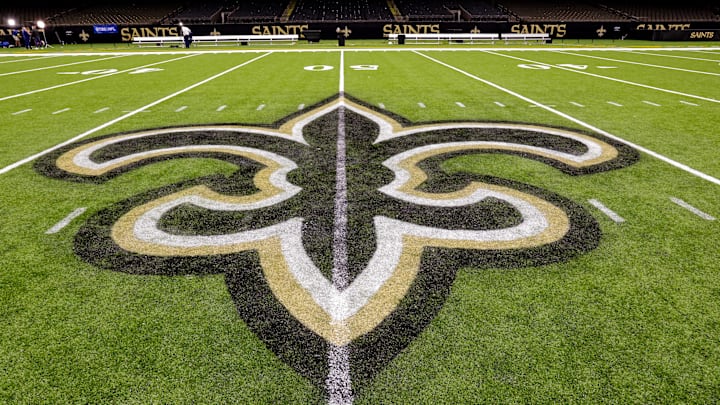 Oct 30, 2022; New Orleans, Louisiana, USA; General view of the New Orleans Saints logo as the midfield logo fleur-de-lis after the game between the New Orleans Saints and the Las Vegas Raiders at Caesars Superdome. Mandatory Credit: Stephen Lew-Imagn Images Oct 30, 2022; New Orleans, Louisiana, USA; General view of the New Orleans Saints logo as the midfield logo fleur-de-lis after the game between the New Orleans Saints and the Las Vegas Raiders at Caesars Superdome. Mandatory Credit: Stephen Lew-Imagn Images