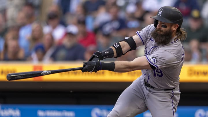 Jun 10, 2024; Minneapolis, Minnesota, USA; Colorado Rockies designated hitter Charlie Blackmon (19) hits a single against the Minnesota Twins in the first inning at Target Field.
