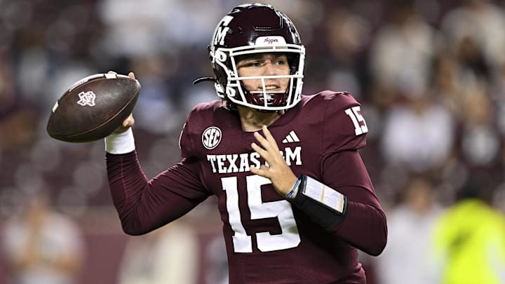 Nov 16, 2024; College Station, Texas, USA; Texas A&M Aggies quarterback Conner Weigman (15) looks to throw the ball during the fourth quarter against the New Mexico State Aggies at Kyle Field. Mandatory Credit: Maria Lysaker-Imagn Images 