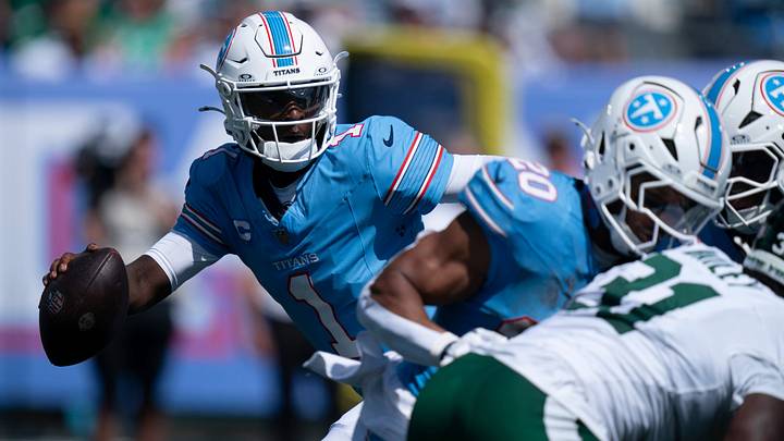 Tennessee quarterback Cam Ward (1) scrambles under New York’s pressure during their season opener at Nissan Stadium Sunday, Sept. 13, 2026. Tennessee quarterback Cam Ward (1) scrambles under New York’s pressure during their season opener at Nissan Stadium Sunday, Sept. 13, 2026.