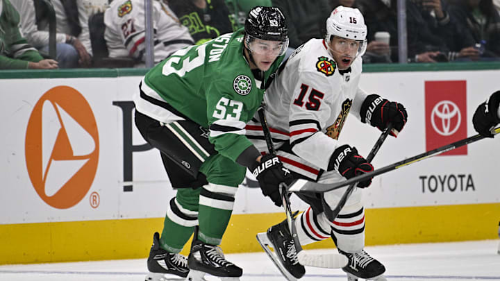 Oct 26, 2024; Dallas, Texas, USA; Dallas Stars center Wyatt Johnston (53) and Chicago Blackhawks center Craig Smith (15) look for the puck during the first period at the American Airlines Center. Mandatory Credit: Jerome Miron-Imagn Images