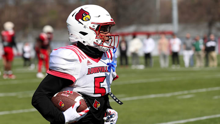 Louisville wide receiver Caullin Lacy (5) caught the ball during spring practice Friday afternoon. Louisville wide receiver Caullin Lacy (5) caught the ball during spring practice Friday afternoon.