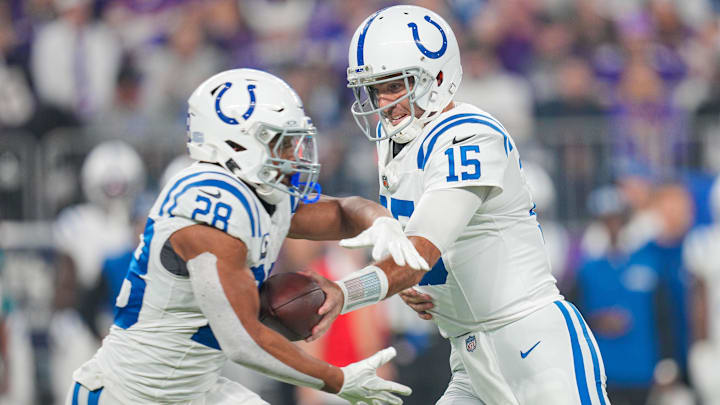 Nov 3, 2024; Minneapolis, Minnesota, USA; Indianapolis Colts quarterback Joe Flacco (15) hands the ball off to running back Jonathan Taylor (28) against the Minnesota Vikings in the first quarter at U.S. Bank Stadium. Mandatory Credit: Brad Rempel-Imagn Images Nov 3, 2024; Minneapolis, Minnesota, USA; Indianapolis Colts quarterback Joe Flacco (15) hands the ball off to running back Jonathan Taylor (28) against the Minnesota Vikings in the first quarter at U.S. Bank Stadium. Mandatory Credit: Brad Rempel-Imagn Images