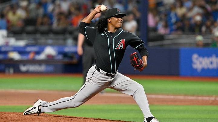 Jun 26, 2026; St. Petersburg, Florida, USA; Arizona Diamondbacks pitcher Juan Burgos (52) delivers a pitch during the seventh inning against Tampa Bay Rays at Tropicana Field. Mandatory Credit: Pablo Robles-Imagn Images Jun 26, 2026; St. Petersburg, Florida, USA; Arizona Diamondbacks pitcher Juan Burgos (52) delivers a pitch during the seventh inning against Tampa Bay Rays at Tropicana Field. Mandatory Credit: Pablo Robles-Imagn Images
