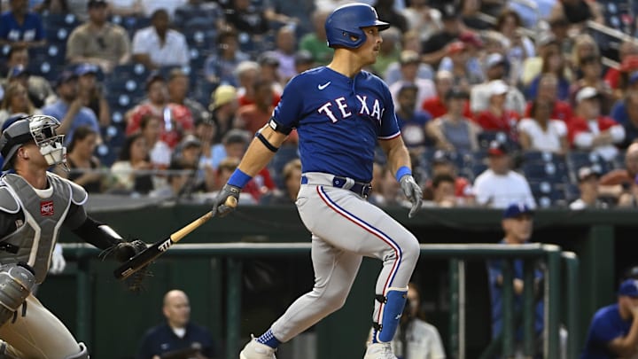 Jul 7, 2023; Washington, District of Columbia, USA; Texas Rangers first baseman Nathaniel Lowe (30) singles against the Washington Nationals during the fifth inning at Nationals Park.