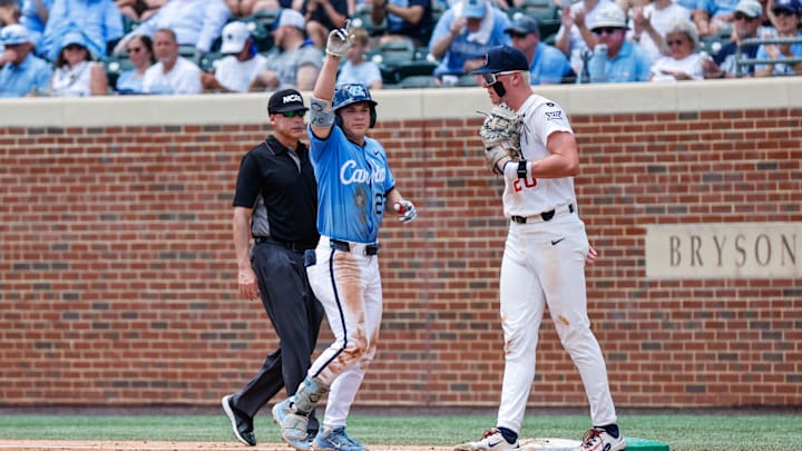 Jun 7, 2025; Chapel Hill, NC, USA;  North Carolina outfielder Kane Kepley (27) celebrates being on first base during the third inning of the Super Regionals game against Arizona in Chapel Hill, North Carolina. Mandatory Credit: Jaylynn Nash-Imagn Images