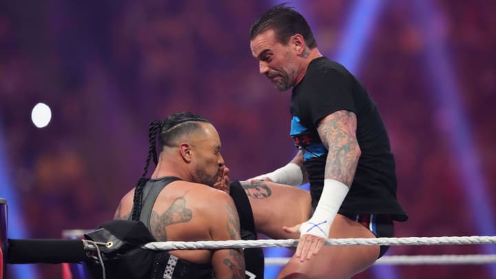 Jan 27, 2024; St. Petersburg, FL, USA; CM Punk attacks Damian Priest during the Men's Royal Rumble match at Tropicana Field.
