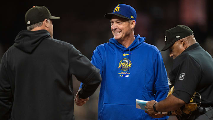 Seattle Mariners manager Dan Wilson (center) is pictured before a game against the San Francisco Giants on Aug. 23 at T-Mobile Park. Seattle Mariners manager Dan Wilson (center) is pictured before a game against the San Francisco Giants on Aug. 23 at T-Mobile Park.
