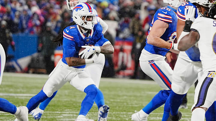 Buffalo Bills running back James Cook runs the ball against the Baltimore Ravens in the NFL playoffs.